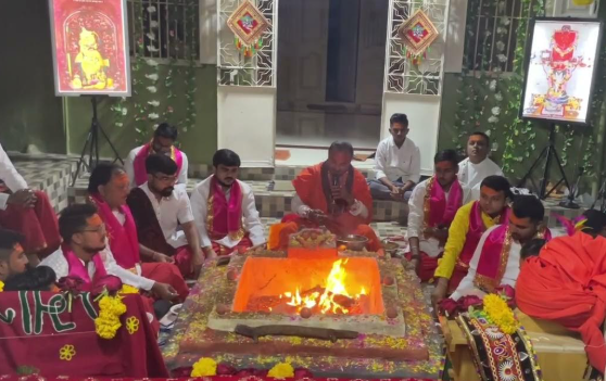 Ancient Vedic yajna ceremony with priests performing rituals around sacred fire